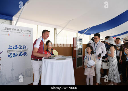 Dutch equestrian Jur Vrieling signs autographs for fans during the Shanghai Grand Prix of the 2019 Shanghai Longines Global Champions Tour in Shanghai Stock Photo