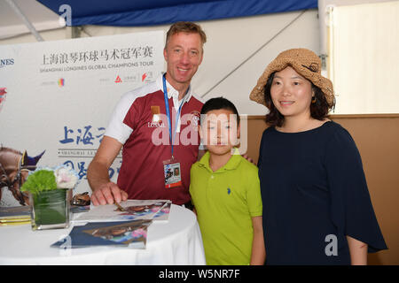 Dutch equestrian Jur Vrieling signs autographs for fans during the Shanghai Grand Prix of the 2019 Shanghai Longines Global Champions Tour in Shanghai Stock Photo