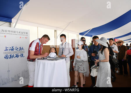 Dutch equestrian Jur Vrieling signs autographs for fans during the Shanghai Grand Prix of the 2019 Shanghai Longines Global Champions Tour in Shanghai Stock Photo