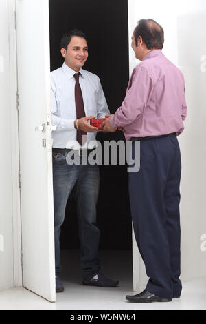 Executive giving boss to a gift Stock Photo