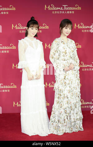 Chinese actress Andy Yang or Yang Zi poses with the wax figure of her during an unveiling ceremony at the Madame Tussauds museum in Beijing, China, 28 Stock Photo