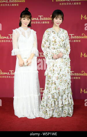 Chinese actress Andy Yang or Yang Zi poses with the wax figure of her during an unveiling ceremony at the Madame Tussauds museum in Beijing, China, 28 Stock Photo