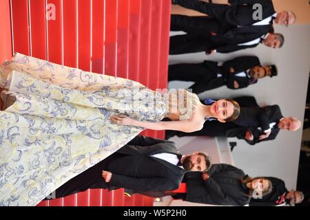 Chinese actress Guan Xiaotong poses as she arrives on the red carpet for the 72nd Cannes International Film Festival in Cannes, France, 17 May 2019. Stock Photo