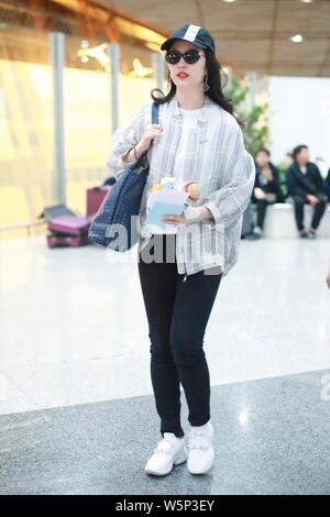 Chinese actress Liu Yifei arrives at the Beijing Capital International Airport before departure in Beijing, China, 11 May 2019.   Shoes: Roger Vivier Stock Photo