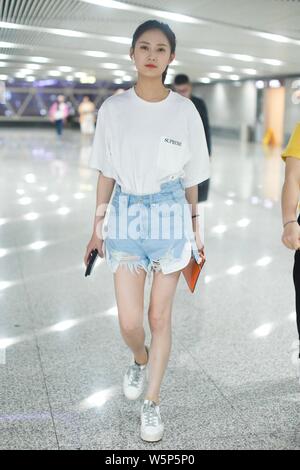 Chinese actress Yukee Chen or Chen Yuqi arrives at the Beijing Capital International Airport before departure in Beijing, China, 28 May 2019.   T-shir Stock Photo