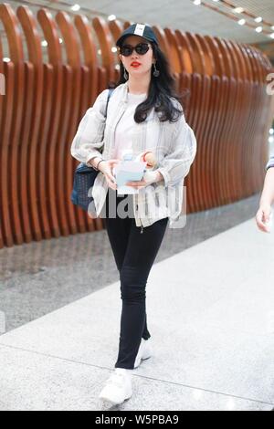 Chinese actress Liu Yifei arrives at the Beijing Capital International Airport before departure in Beijing, China, 11 May 2019.   Shoes: Roger Vivier Stock Photo