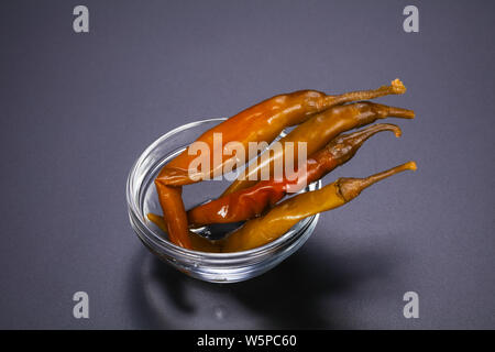 Marinated chilli pepper heap in the bowl Stock Photo