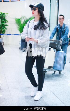 Chinese actress Liu Yifei arrives at the Beijing Capital International Airport before departure in Beijing, China, 11 May 2019.   Shoes: Roger Vivier Stock Photo