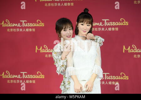 Chinese actress Andy Yang or Yang Zi poses with the wax figure of her during an unveiling ceremony at the Madame Tussauds museum in Beijing, China, 28 Stock Photo