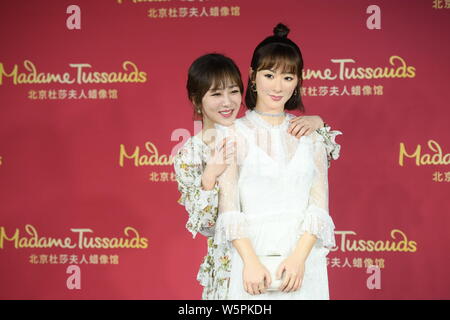 Chinese actress Andy Yang or Yang Zi poses with the wax figure of her during an unveiling ceremony at the Madame Tussauds museum in Beijing, China, 28 Stock Photo