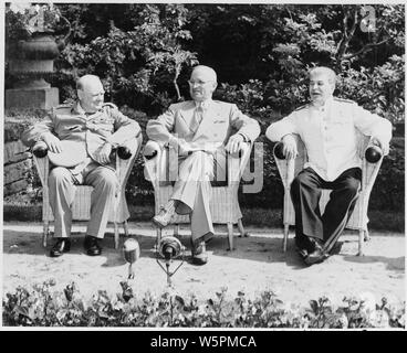 L to R: British Prime Minister Winston Churchill, President Harry S. Truman, and Soviet leader Josef Stalin in the garden of Cecilienhof Palace before meeting for the Potsdam Conference in Potsdam, Germany. Stock Photo