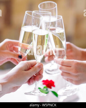 Friends in the restaurant having a toast. Stock Photo