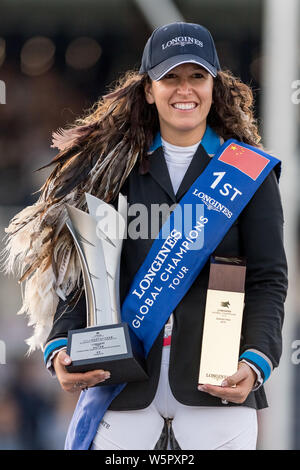 Danielle Goldstein of Israel left poses with her trophy after winning