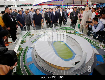 (190730) -- BEIJING, July 30, 2019 (Xinhua) -- Cambodian Prime Minister Samdech Techo Hun Sen and Chinese Ambassador to Cambodia Wang Wentian attend an event to mark the completion of concrete seat installation at the China-funded national stadium in Phnom Penh, Cambodia, July 29, 2019. (Photo by Sovannara/Xinhua) Stock Photo