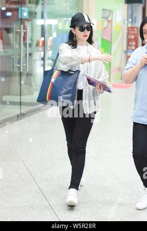 Chinese actress Liu Yifei arrives at the Beijing Capital International Airport before departure in Beijing, China, 11 May 2019.   Shoes: Roger Vivier Stock Photo