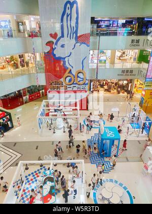 Customers visit an exhibition held to mark the 60th anniversary of iconic Chinese candy brand White Rabbit at a shopping mall in Guangzhou city, south Stock Photo