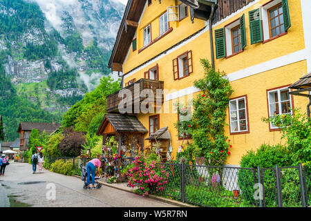 HALLSTATT, AUSTRIA - JULY 08 2019:Hallstatt, a town on Hallstatter Lake in Salzkammergut region was declared World Heritage Site in 1997. It's known f Stock Photo