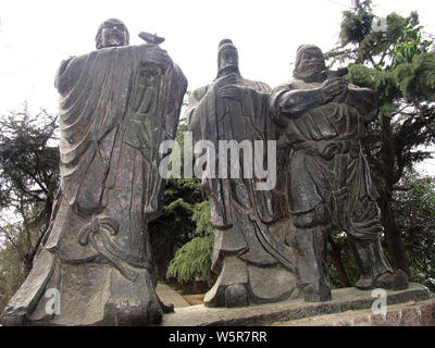 Stone statues of (from left) ancient Chinese warlord Liu Bei, military generals Guan Yu and Zhang Fei are pictured at the City of the Three Kingdoms o Stock Photo