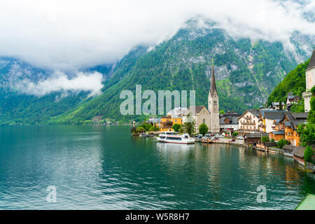 HALLSTATT, AUSTRIA - JULY 08 2019:Hallstatt, a town on Hallstatter Lake in Salzkammergut region was declared World Heritage Site in 1997. It's known f Stock Photo