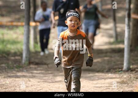 Kids compete in the Spartan kids' race to mark the International Children's Day in Beijing, China, 1 June 2019.   More than ten thousand children part Stock Photo