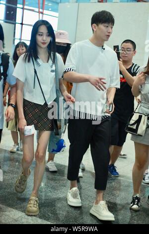 Chinese actress Zheng Shuang, left, and her boyfriend arrive at the Beijing Capital International Airport in Beijing, China, 20 June 2019. Stock Photo