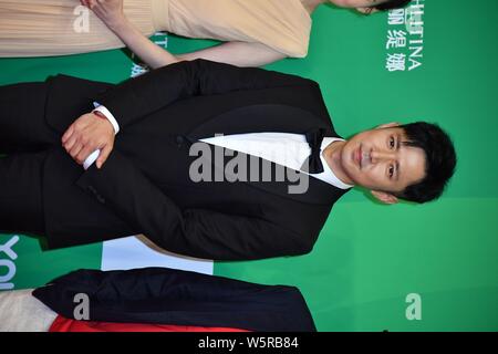 Chinese actor Gao Xin arrives on the red carpet for the 25th Shanghai TV Festival in Shanghai, China, 14 June 2019. Stock Photo