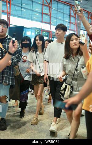 Chinese actress Zheng Shuang, left, and her boyfriend arrive at the Beijing Capital International Airport in Beijing, China, 20 June 2019. Stock Photo