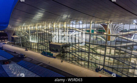 The Beijing Daxing International Airport is illuminated by light projections at night in Beijing, China, 27 June 2019. Beijing Daxing International Ai Stock Photo