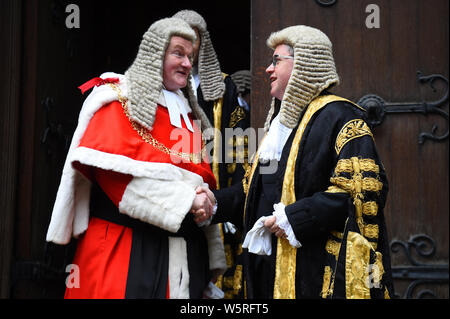 Robert Buckland QC (right) shakes hands with the Lord Chief Justice, Lord Burnett of Maldon, as he arrives at the Royal Courts of Justice in London for his swearing in ceremony as Lord Chancellor. Stock Photo
