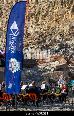 Lydbrook Brass Band play a 'Proms in the Quarry' at Barnhill Quarry, Forest of Dean, Gloucestershire. Event includes flypast to 'The Dambusters' Stock Photo