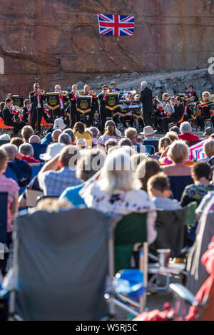 Lydbrook Brass Band play a 'Proms in the Quarry' at Barnhill Quarry, Forest of Dean, Gloucestershire. Event includes flypast to 'The Dambusters' Stock Photo