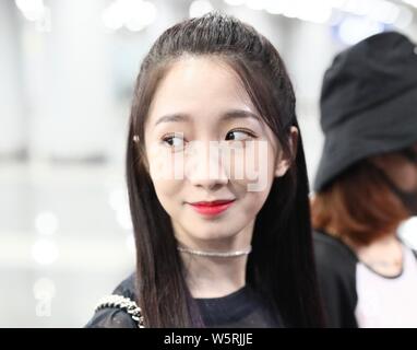 Meng Meiqi of Chinese idol girl group Rocket Girls 101 arrives at the Beijing Capital International Airport in Beijing, China, 3 June 2019.   Handbag: Stock Photo