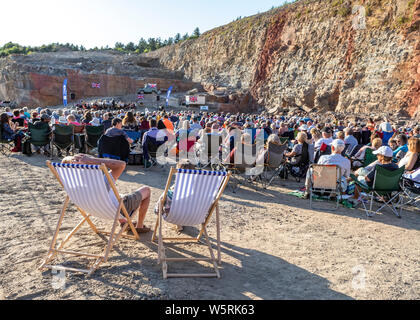 Lydbrook Brass Band play a 'Proms in the Quarry' at Barnhill Quarry, Forest of Dean, Gloucestershire. Event includes flypast to 'The Dambusters' Stock Photo