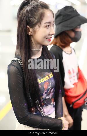 Meng Meiqi of Chinese idol girl group Rocket Girls 101 arrives at the Beijing Capital International Airport in Beijing, China, 3 June 2019.   Handbag: Stock Photo