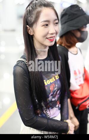 Meng Meiqi of Chinese idol girl group Rocket Girls 101 arrives at the Beijing Capital International Airport in Beijing, China, 3 June 2019.   Handbag: Stock Photo