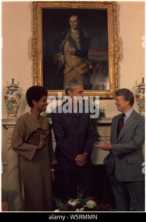 Mrs. Michael Manley, Prime Minister Michael Manley and Jimmy Carter during an Oval Office meeting. Stock Photo