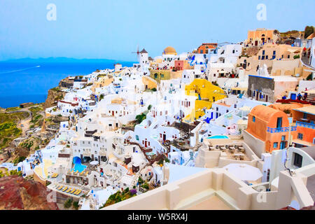 Santorini island, Greece, Oia village panorama with windmill and colorful houses Stock Photo
