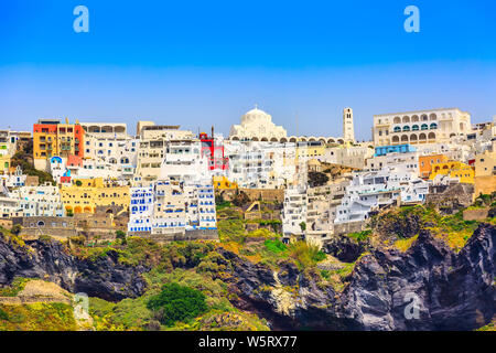 Fira or Thira panoramic view in Santorini Island with white and blue houses on high volcanic rocks in Greece Stock Photo