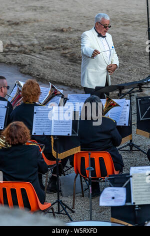 Lydbrook Brass Band play a 'Proms in the Quarry' at Barnhill Quarry, Forest of Dean, Gloucestershire. Event includes flypast to 'The Dambusters' Stock Photo