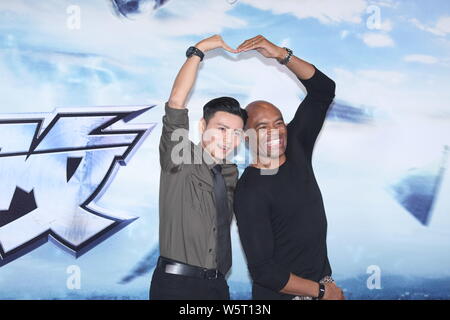 Former UFC Middleweight Champion Anderson Silva, right, and Chinese actor Zhang Jin attend a press conference for new movie 'The Invincible Dragon' in Stock Photo