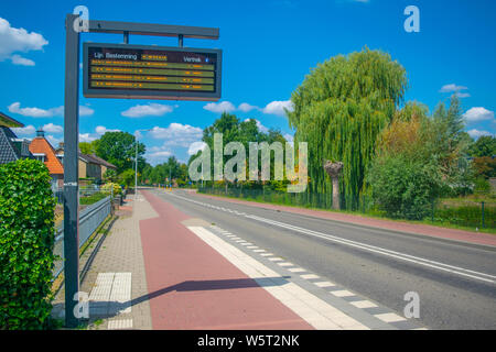 Information panel with Dutch bus departure times,electronic bulletin ...