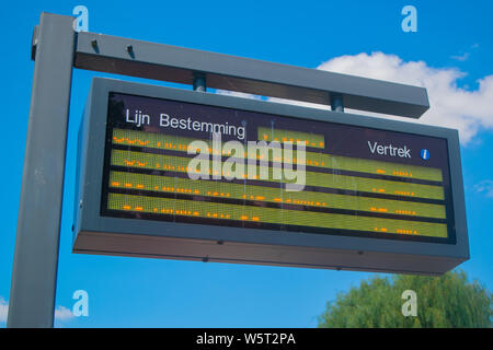 Information panel with Dutch bus departure times,electronic bulletin ...