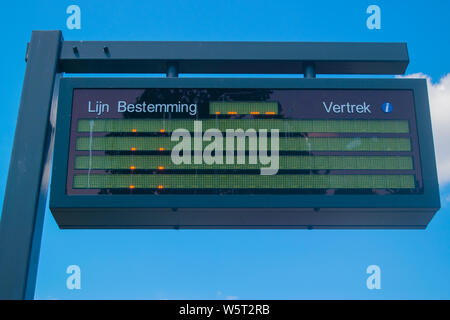 Information panel with Dutch bus departure times,electronic bulletin ...