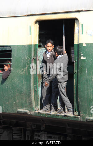 School children traveling in a local train Stock Photo