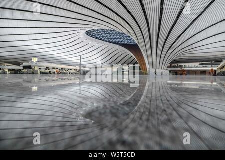 The Beijing Daxing International Airport is illuminated by light projections at night in Beijing, China, 27 June 2019. Beijing Daxing International Ai Stock Photo