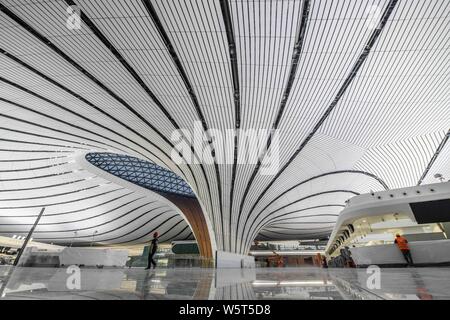 The Beijing Daxing International Airport is illuminated by light projections at night in Beijing, China, 27 June 2019. Beijing Daxing International Ai Stock Photo