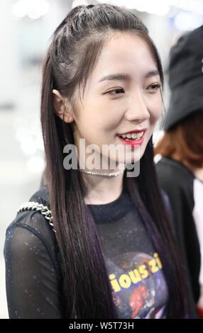 Meng Meiqi of Chinese idol girl group Rocket Girls 101 arrives at the Beijing Capital International Airport in Beijing, China, 3 June 2019.   Handbag: Stock Photo