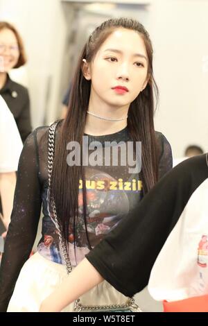 Meng Meiqi of Chinese idol girl group Rocket Girls 101 arrives at the Beijing Capital International Airport in Beijing, China, 3 June 2019.   Handbag: Stock Photo