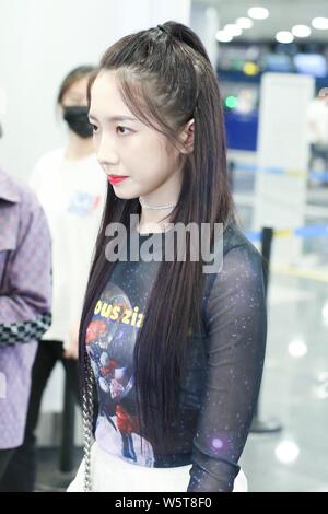 Meng Meiqi of Chinese idol girl group Rocket Girls 101 arrives at the Beijing Capital International Airport in Beijing, China, 3 June 2019.   Handbag: Stock Photo