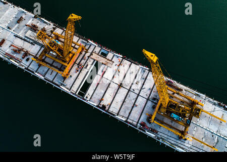 Aerial view of the last bridge deck of the Xiangxi Yangtze River Bridge being installed in Zigui county, Yichang city, central China's Hubei province, Stock Photo